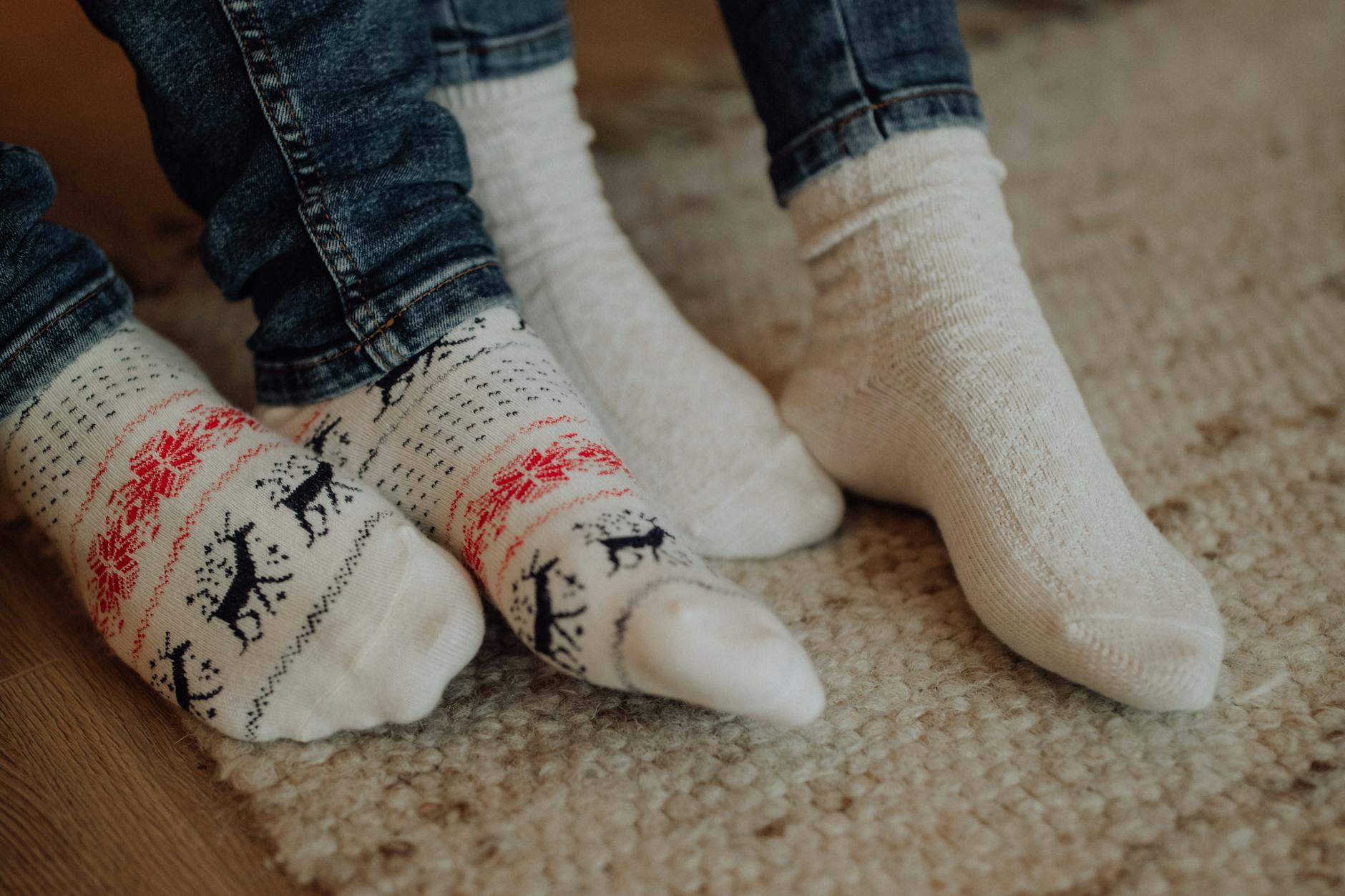 close up of people in white socks