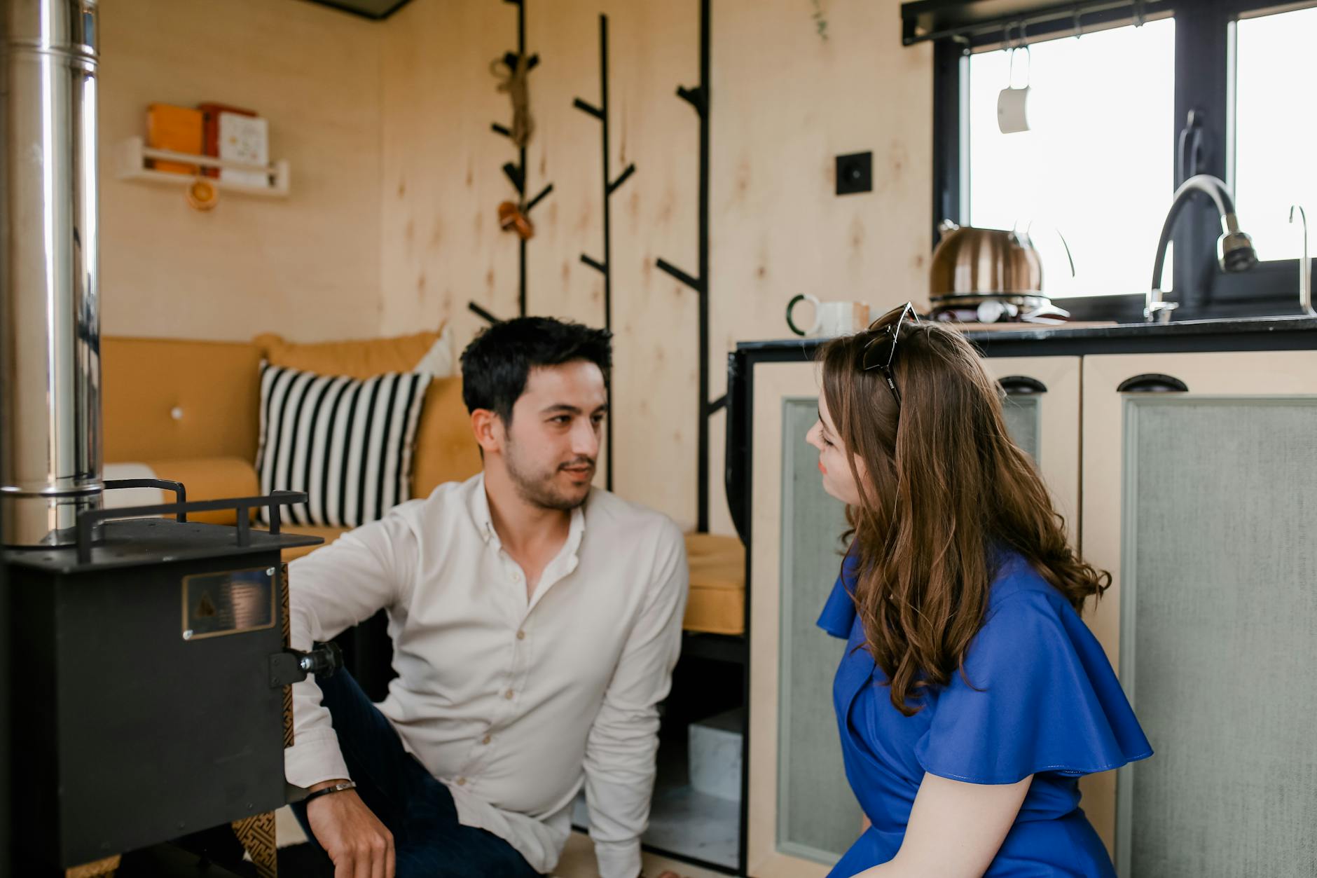 a man and woman looking at each other