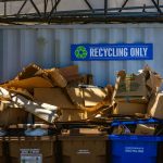 garbage containers with recycling only sign