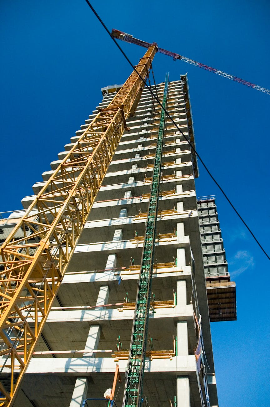 industrial crane near constructed building