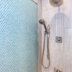 stainless steel shower head inside bathroom
