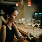 woman leaning on table