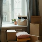 brown cardboard box on white bed
