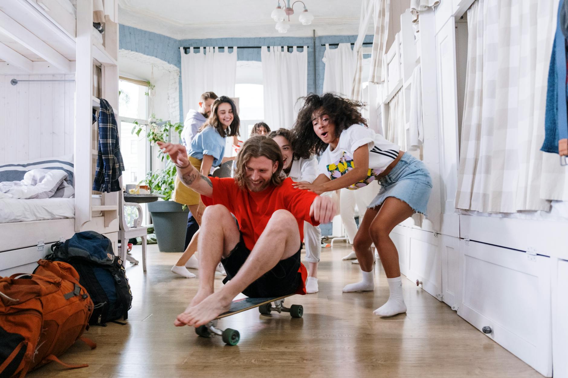 group of people playing with a longboard