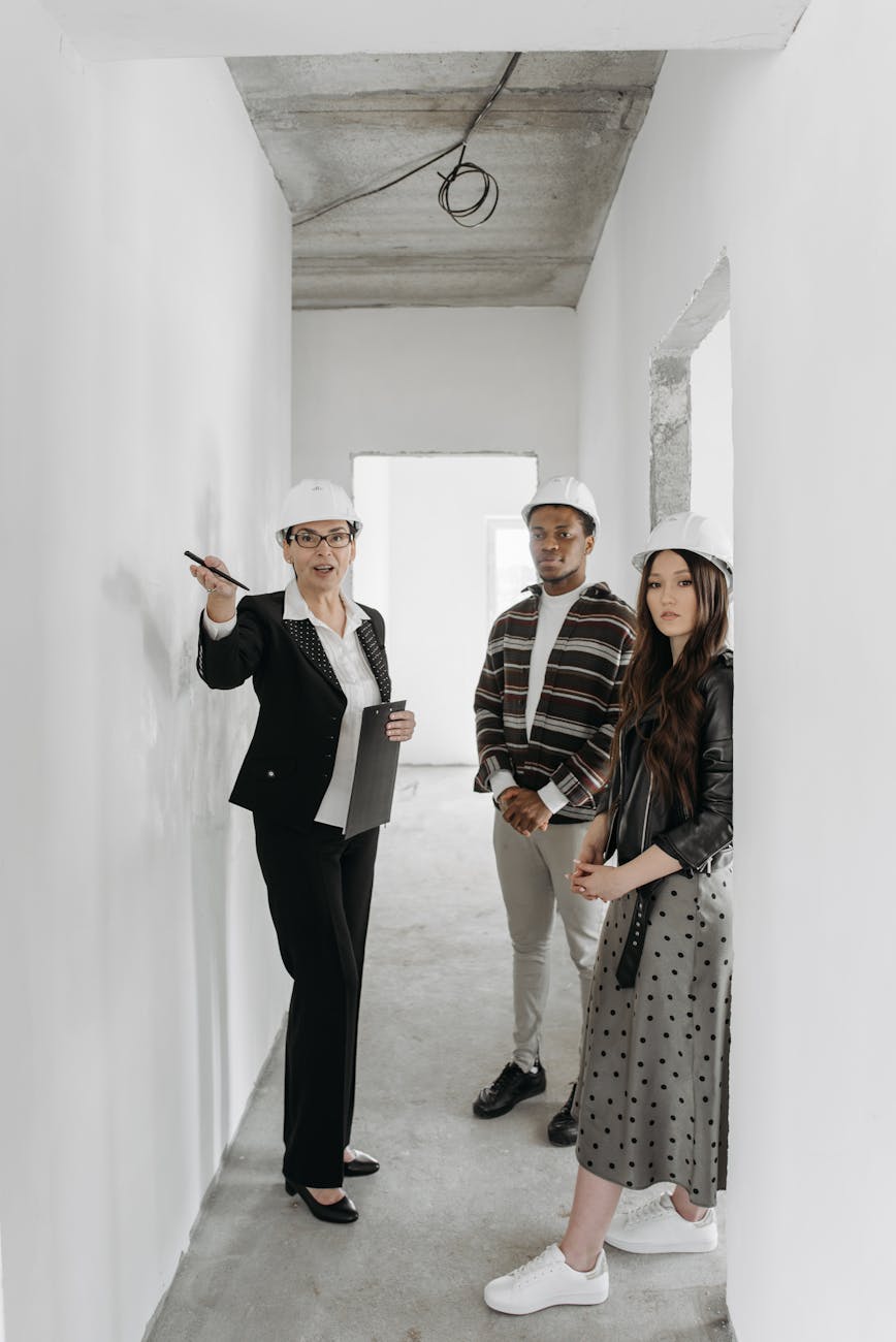 people wearing hard hats touring around the house