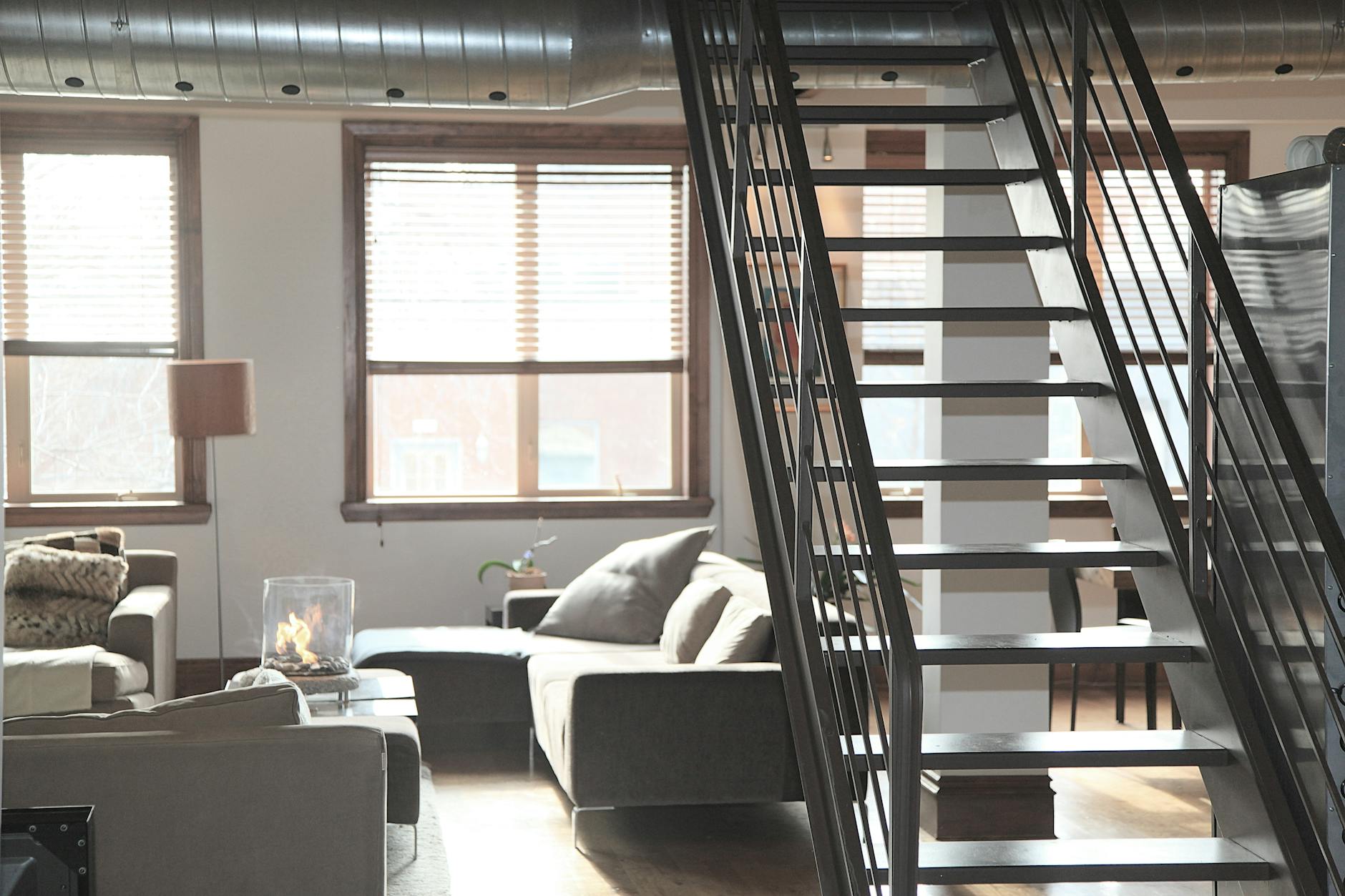gray couch beside window