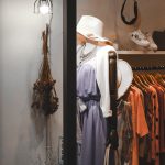 assorted hanged clothes near white light bulb