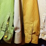 close up of clothes hanging on fabric