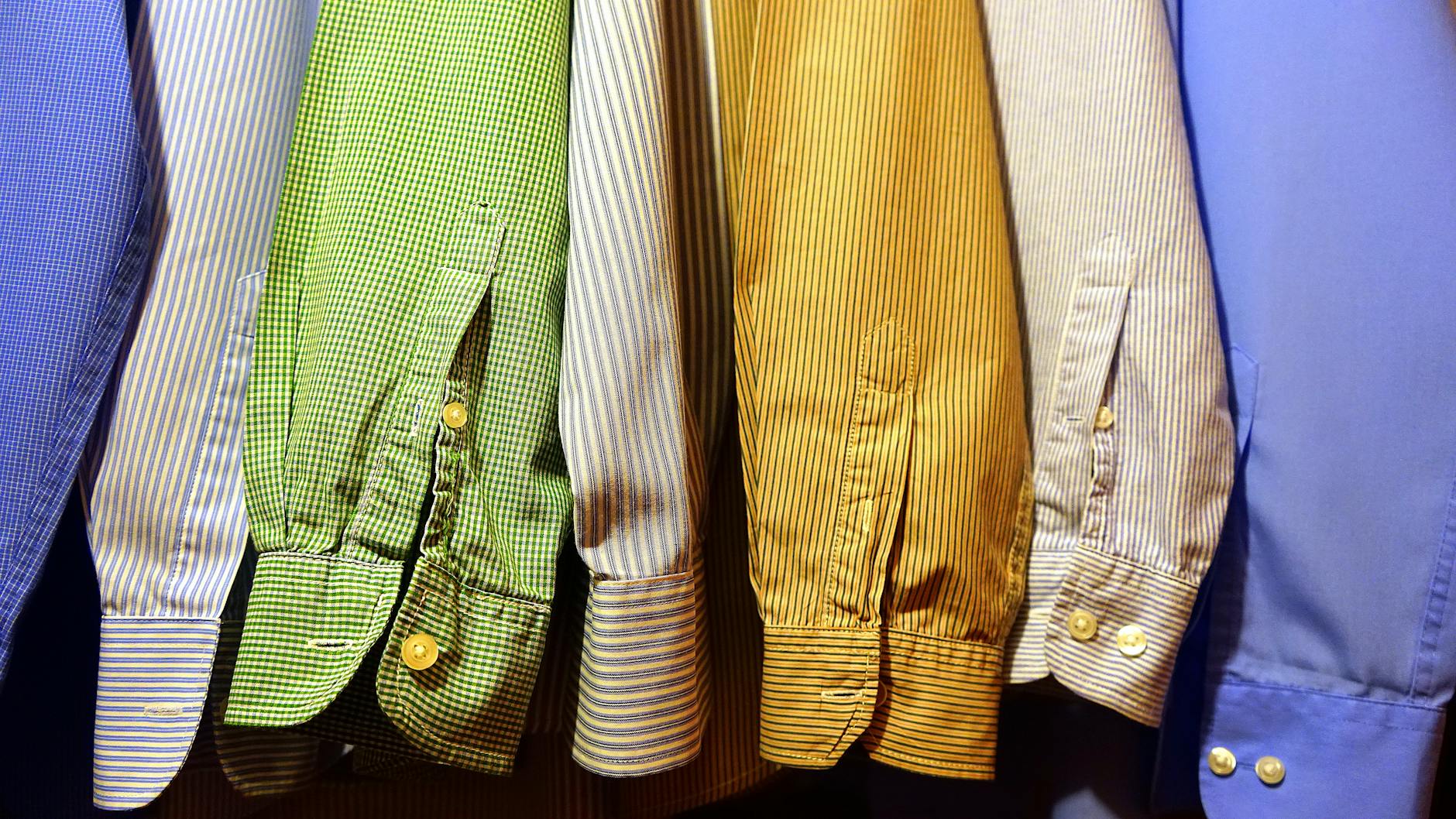 close up of clothes hanging on fabric