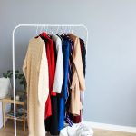assorted colored dresses on white clothes rack