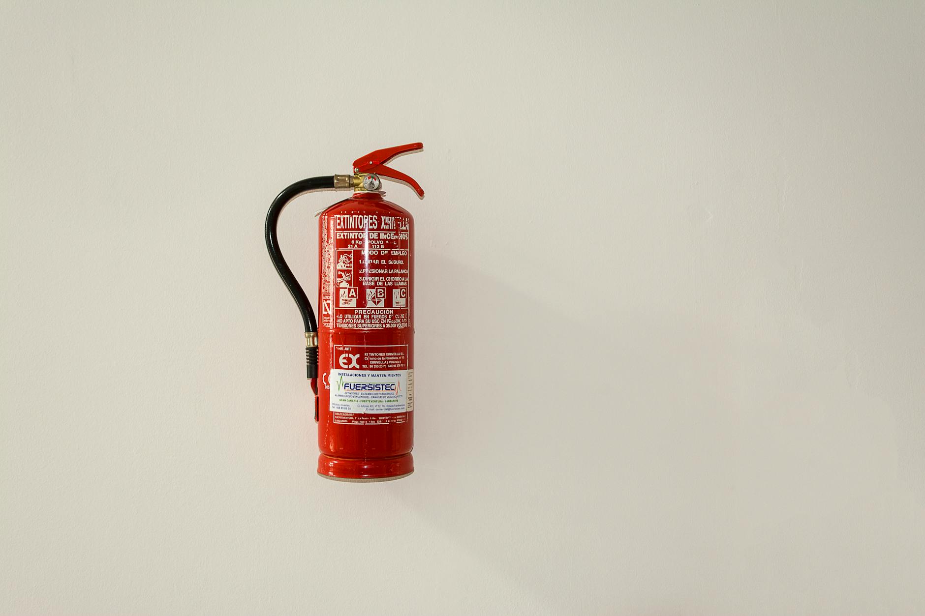 a fire extinguisher hanging on the wall