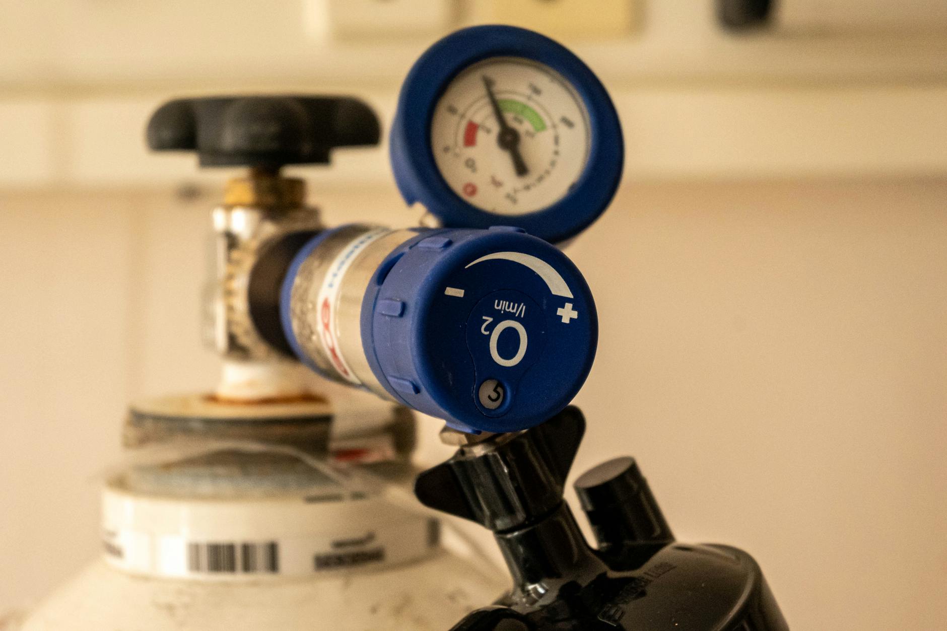 close up of oxygen tank with pressure gauge