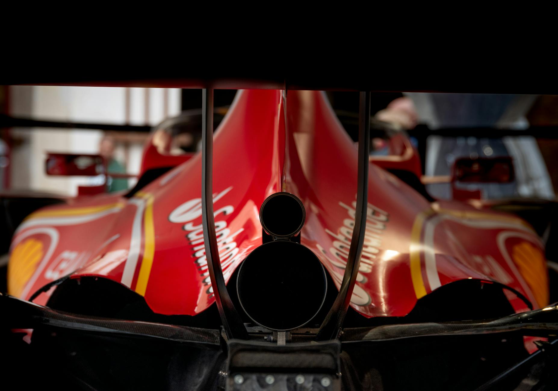 close up of red formula race car rear end
