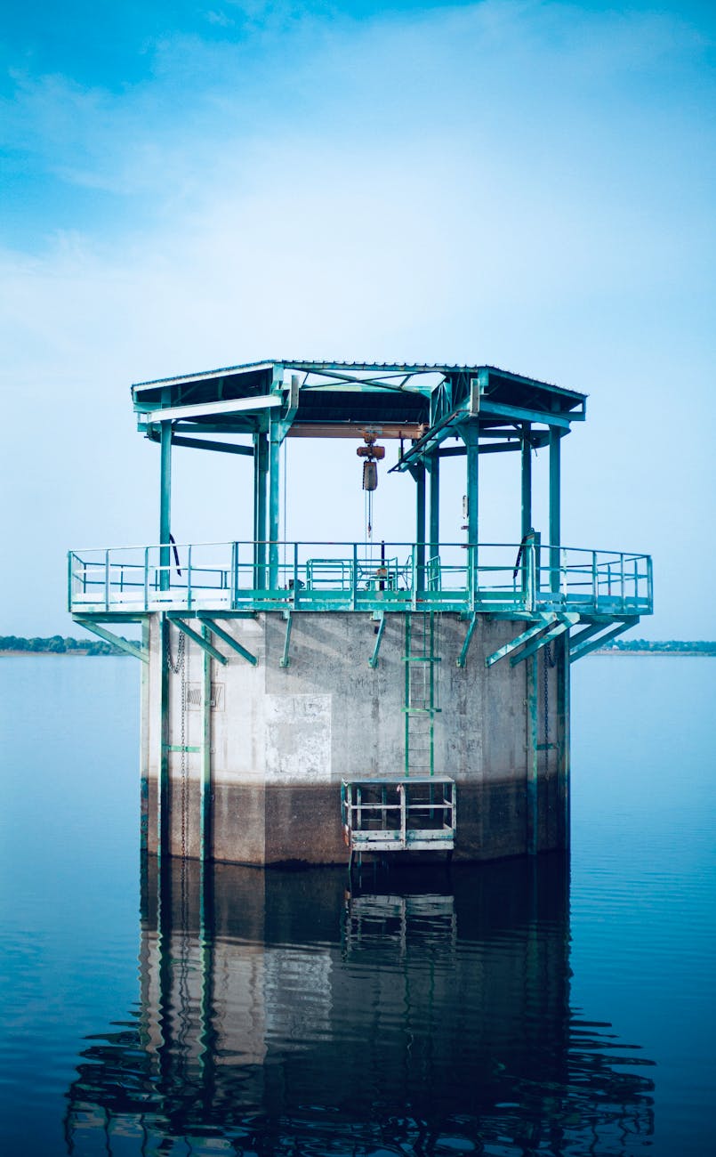 industrial water tower in serene lake setting