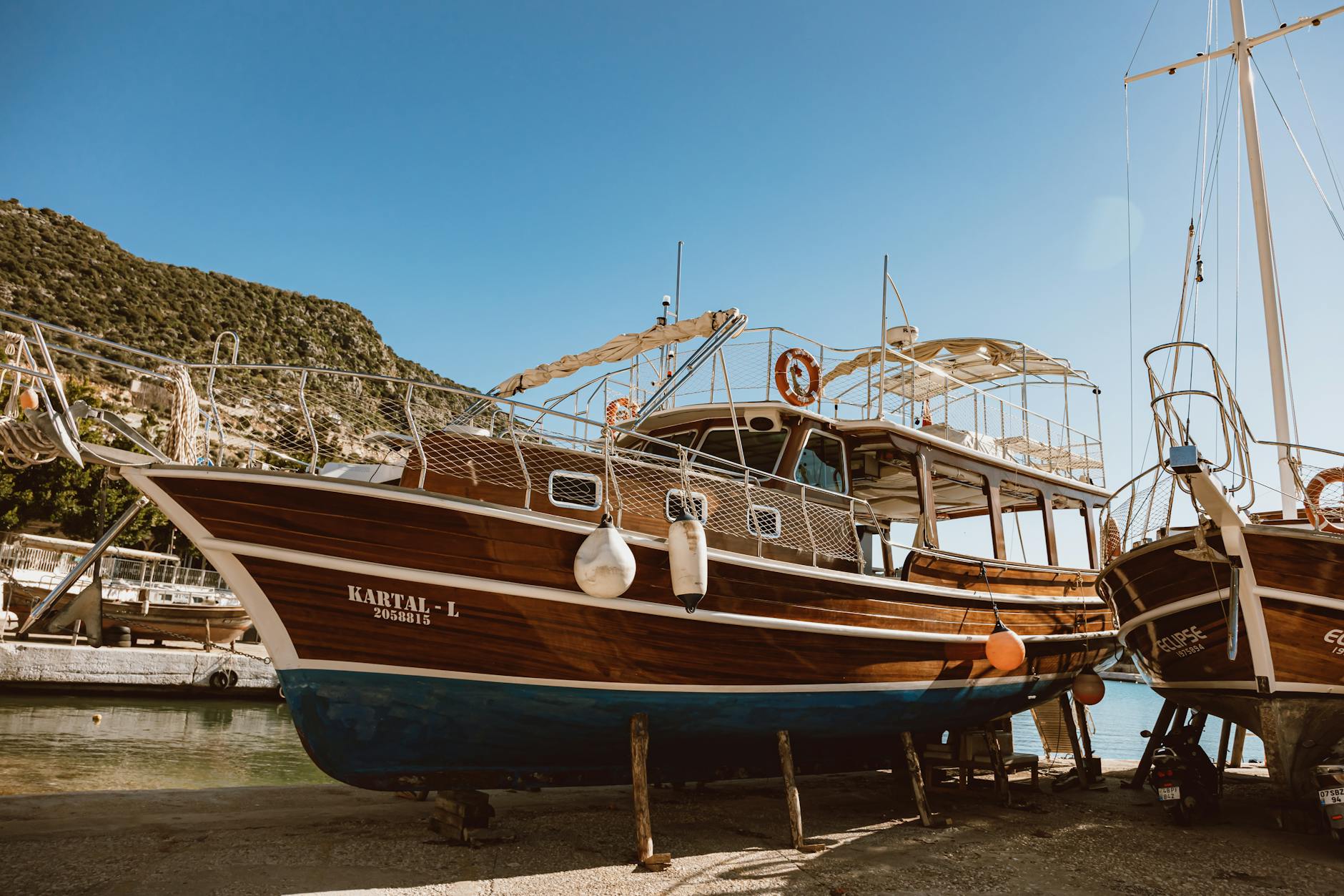 docked boats on a shore